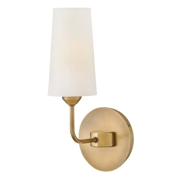 Lewis offers traditional charm paired with updated, transitional elements. Tall natural paper shades feature fine stitching detail against a Heritage Brass or Black Oxide finish to enhance timeless interiors.