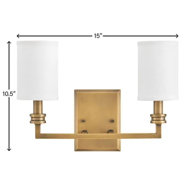 A modern interpretation of traditional torch sconces, Moore’s square stems and beveled back plate are complemented by decorative cast details. Off-white linen shades accentuated by top and bottom binding create a sophisticated, tailored look. - alternate view