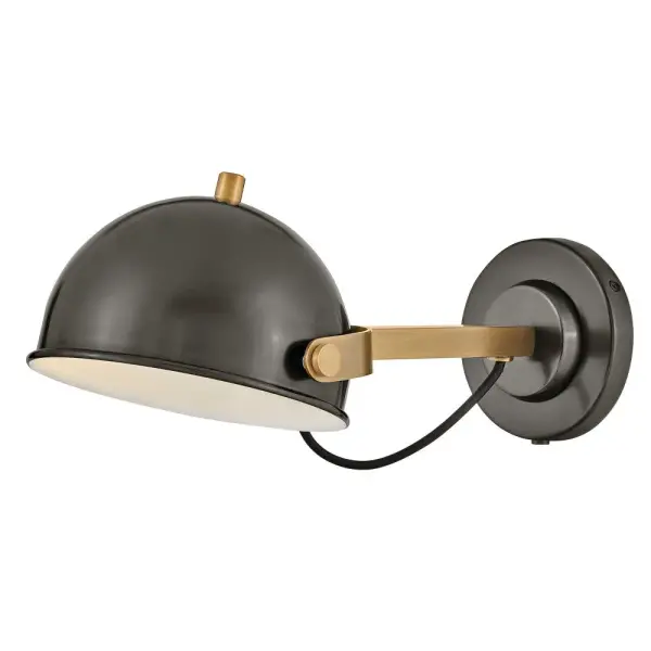A modern bedside sconce with a vintage feel, Spence’s adjustable, rotating shade, painted white interior, and convenient on/off switch create the ideal reading or task light. Heritage Brass details and removable, black, fabric-wrapped cord complement a Black Oxide or Chalk White finish.