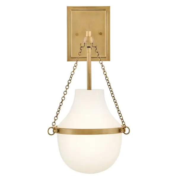 Fusing a sculpted, modern form with classically styled details, Collins features a transitional teardrop shade crafted from blown, Cased Opal glass. A central metal band and delicate chain uprights are available in Black Oxide, Heritage Brass, Heritage Bronze, or Polished Nickel finishes.