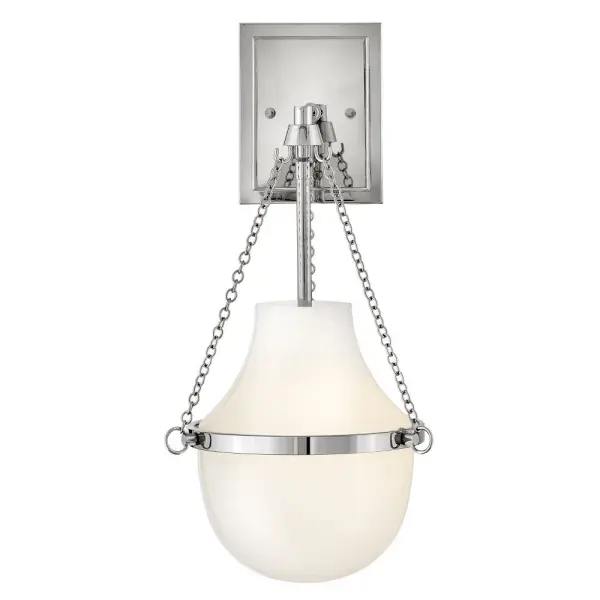 Fusing a sculpted, modern form with classically styled details, Collins features a transitional teardrop shade crafted from blown, Cased Opal glass. A central metal band and delicate chain uprights are available in Black Oxide, Heritage Brass, Heritage Bronze, or Polished Nickel finishes.