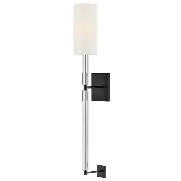 Glamorous crystal stems are the focal point of Anika’s alluring, synched silhouette. A columnar White Linen shade diffuses bright yet soft illumination, creating a slim, sophisticated look.
