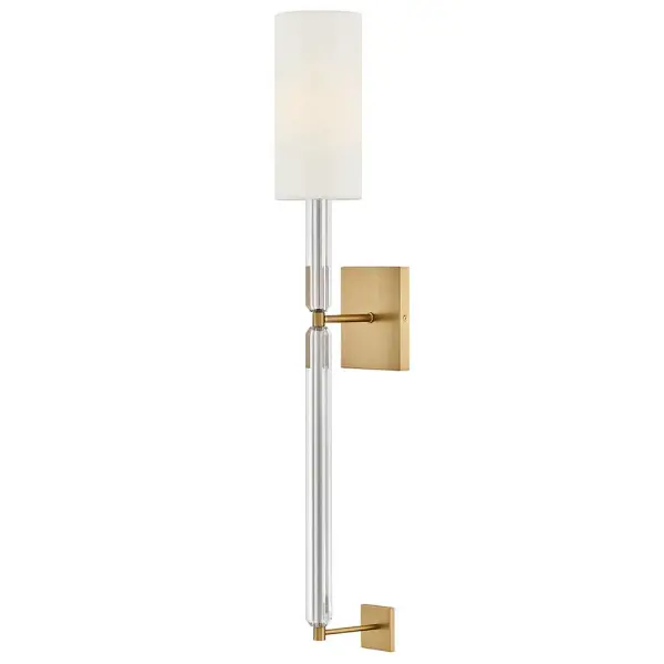 Glamorous crystal stems are the focal point of Anika’s alluring, synched silhouette. A columnar White Linen shade diffuses bright yet soft illumination, creating a slim, sophisticated look.