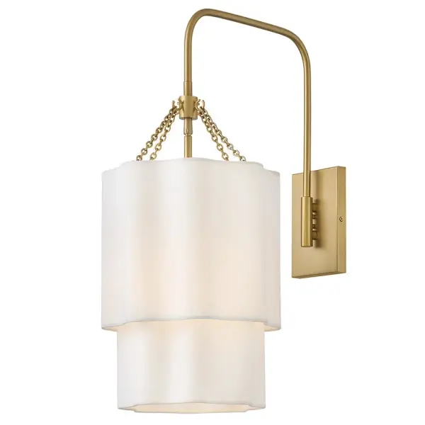 Splendidly soft, Gwen’s shapely scalloped shade complements inviting light with layers of Off-White Linen suspended from delicate chains and minimal metal stems. A Black or Lacquered Brass finish provides a versatile complement to any interior style.