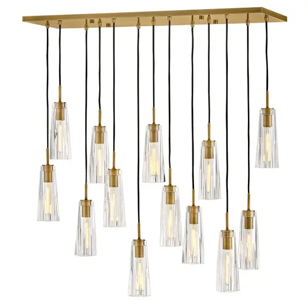 The Cosette linear chandelier makes a stunning statement with its elongated 46-inch silhouette and luxurious cut crystal elements. Heritage brass finish adds warmth while clear crystal creates rich, multi-faceted light patterns. Adjustable cords simplify installation and customization.
