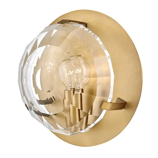 The Nala sconce combines traditional elegance with striking optic-crystal lenses that create beautiful light refraction. Its compact 8.75" size makes it perfect for smaller spaces while the Heritage Brass finish adds warmth and sophistication.