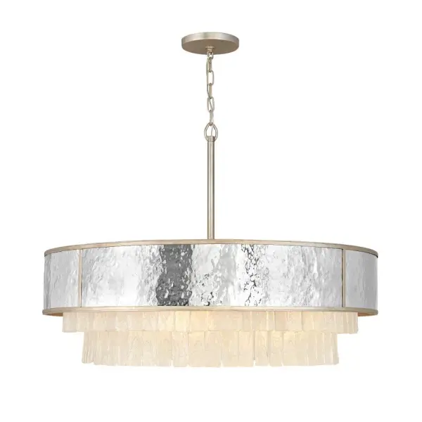 The Reverie chandelier combines hammered stainless steel with textured crystal accents for a luxurious transitional look. At 36 inches wide, this substantial drum fixture creates dramatic impact in dining rooms and foyers.