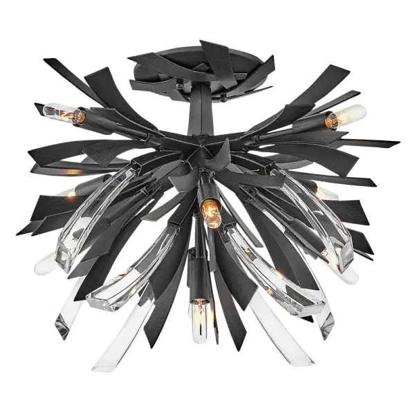 The Vida semi-flush mount delivers high-impact contemporary style with sculptural metalwork and crystal accents. Its dramatic design and unique canopy detailing make it a showstopping focal point for modern interiors.