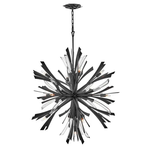 The Vida Small Orb Chandelier delivers high-impact contemporary design with its sculptural orb silhouette, crystal accents, and sophisticated brushed graphite finish. A bold statement piece that transforms large spaces.