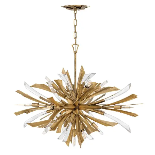 The Vida chandelier delivers bold contemporary style with its flourishing sculptural design and crystal embellishments. At 36 inches wide, this large-scale fixture commands attention in grand spaces while the burnished gold finish adds warmth.