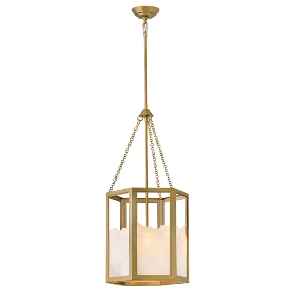 The Veleta pendant brings nature indoors with its distinctive jagged-edge alabaster shade inspired by snowy mountain peaks. Each fixture is truly one-of-a-kind with natural graining and organic textures, framed by a sophisticated geometric brass structure.