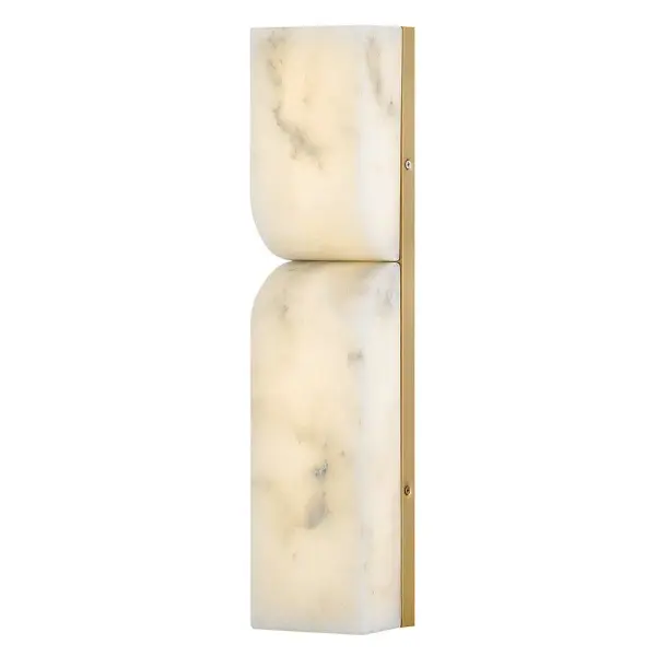 The Alune sconce combines modern asymmetrical design with natural alabaster stone, creating a sophisticated lighting statement. Integrated LEDs highlight the unique variations in the stone while the lacquered brass finish adds warmth.