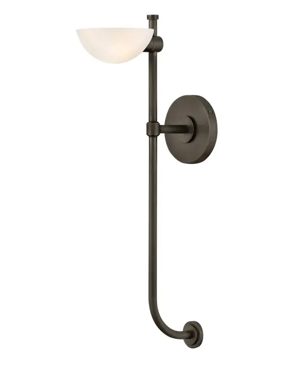 The Merit sconce combines a tall torchier silhouette with soft uplight diffusion through etched white glass. Its minimal design and Black Oxide finish make it versatile for modern and traditional spaces alike.