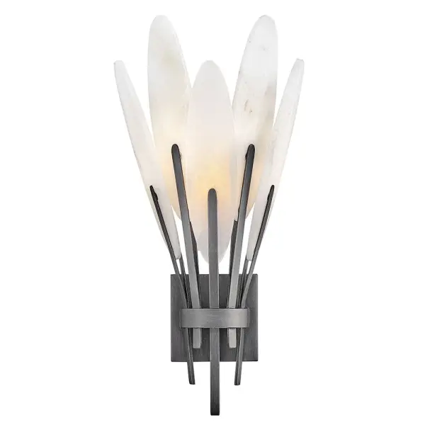The Nerine Large Sconce showcases nature's artistry with hand-carved alabaster leaves that create a warm, ambient glow. Each piece features unique stone variations, making it a true statement piece for sophisticated interiors.