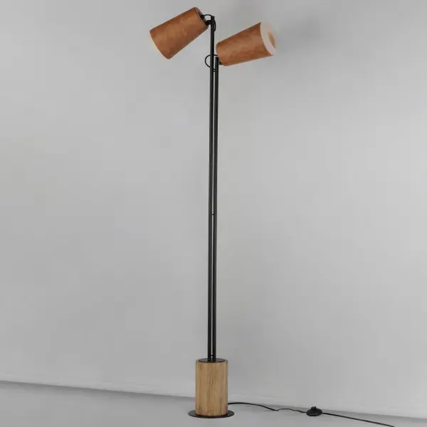 Rugged Brown leather shades are stitched and snugly fit over softly angled conical forms to create a rustic and warm lighting resource. Sturdy bases of cylindrical Distressed Wood adds a natural element with countryside appeal. Adjustable joints on the portable floor lamp and swing arm sconce allows you to direct the lighting where needed for function while the pendants glass-backed shade reveals the leather's delightful natural qualities with a glow from the lamp inside. An additional switch on the sconce provides functional convenience to the design. - alternate view