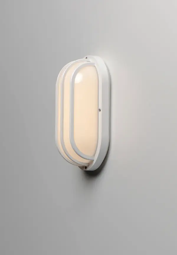 Classic bulkhead style fixtures made of high impact polycarbonate. Unlike the die cast counterparts these fixtures are non-corrosive so works perfect in coastal areas. Available in both integrated LED and E26 socket configurations, these make for a low maintenance and cost effective alternative. Collection: Bulwark Finish: White Glass: Frosted Width: 10.50" Height: 5.75" Length: 4.00" Weight: 1.06 lb Extension from Wall: 4.00" Wire: 8" Canopy: 10.5"x5.75" Number of Bulbs: 1 Maximum Wattage: 60.00 W Bulb Type: A19 Bulb Base: E26 Medium Light Source: Incandescent Dimmable Voltage: 120.00 V Material: Polycarbonate, Aluminum Safety Listing: cETLus Safety Rating: Wet ADA Manufacturer Warranty: 1 Spec Sheet Instructions Parts Diagram - alternate view