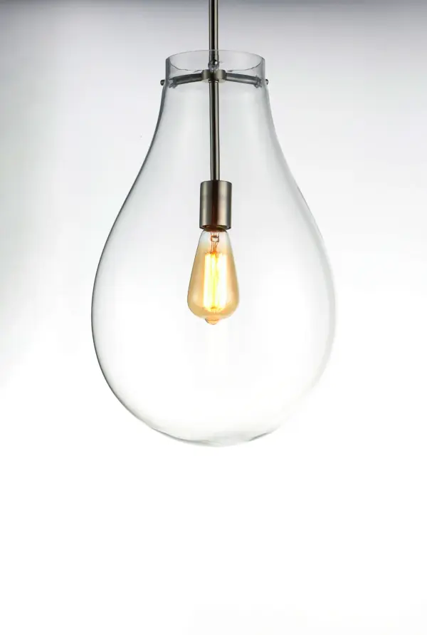 The crystal clear, large-scale glass pendants attest to the craft of hand-blown glass with their impressive scale. These hand crafted glass pendants embody simplicity and minimalism. Accented with Satin Nickel hardware, the style pairs well in a variety of settings. - alternate view