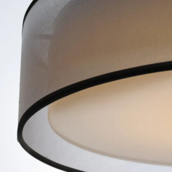 Drum shades in a variety of fabrics and materials are a core lighting offering. Flush mounts, pendants, and ADA sconces are available in options of linen, organza, grasscloth, and sound absorbing grey felt shades. An internal acrylic diffuser, illuminated by an evenly dispersed powerful LED light source, directs light downward and produces an ambient glow inside the outer shade. This lens features a crisp and tidy twist-lock mechanism that eliminates any visible hardware. whether it is put in a residential or commercial context, this collection meets the necessary application needs while adding style to the space. - alternate view