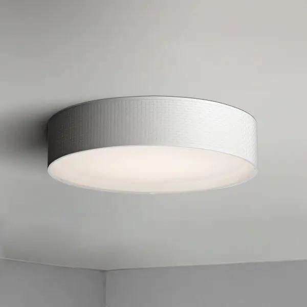 Drum shades in a variety of fabrics and materials are a core lighting offering. Flush mounts, pendants, and ADA sconces are available in options of linen, organza, grasscloth, and sound absorbing grey felt shades. An internal acrylic diffuser, illuminated by an evenly dispersed powerful LED light source, directs light downward and produces an ambient glow inside the outer shade. This lens features a crisp and tidy twist-lock mechanism that eliminates any visible hardware. whether it is put in a residential or commercial context, this collection meets the necessary application needs while adding style to the space. Collection: Prime Width: 25.00" Height: 5.50" Length: 25.00" Weight: 6.66 lb Wire: 8" Bulbs Included Number of Bulbs: 1 Maximum Wattage: 45.00 W Bulb Type: LED Bulb Base: Integrated Light Source: LED Light Output: 1880.00 lm Color Temperature: 3000 K CRI: 90 Rated Average Life: 35000 Voltage: 120.00 V Material: Steel, Acrylic, Fabric Safety Listing: cETLus Safety Rating: Dry LED Spec Sheet Instructions - alternate view