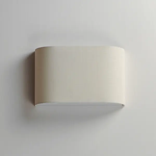 Drum shades in a variety of fabrics and materials are a core lighting offering. Flush mounts, pendants, and ADA sconces are available in options of linen, organza, grasscloth, and sound absorbing grey felt shades. An internal acrylic diffuser, illuminated by an evenly dispersed powerful LED light source, directs light downward and produces an ambient glow inside the outer shade. This lens features a crisp and tidy twist-lock mechanism that eliminates any visible hardware. whether it is put in a residential or commercial context, this collection meets the necessary application needs while adding style to the space. Collection: Prime Finish: Oatmeal Linen Width: 13.00" Height: 8.25" Weight: 2.25 lb Extension from Wall: 3.75" Wire: 8" Canopy: 8.25"x13" Bulbs Included Number of Bulbs: 1 Maximum Wattage: 10.00 W Bulb Type: LED Bulb Base: Integrated Light Source: LED Light Output: 550.00 lm Color Temperature: 3000 K CRI: 90 Rated Average Life: 35000 Voltage: 120.00 V Material: Fabric, Polycarbonate, Steel Safety Listing: cETLus Safety Rating: Dry ADA LED Spec Sheet Instructions - alternate view