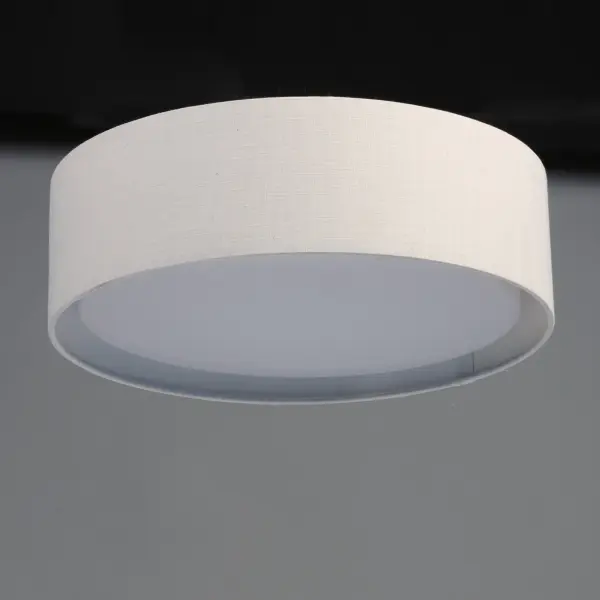 Drum shades in a variety of fabrics and materials are a core lighting offering. Flush mounts, pendants, and ADA sconces are available in options of linen, organza, grasscloth, and sound absorbing grey felt shades. An internal acrylic diffuser, illuminated by an evenly dispersed powerful LED light source, directs light downward and produces an ambient glow inside the outer shade. This lens features a crisp and tidy twist-lock mechanism that eliminates any visible hardware. whether it is put in a residential or commercial context, this collection meets the necessary application needs while adding style to the space. Collection: Prime Width: 20.00" Height: 5.50" Length: 20.00" Weight: 6.66 lb Wire: 6" Canopy: 17.75"x17.75"x0.75" Bulbs Included Number of Bulbs: 1 Maximum Wattage: 28.00 W Bulb Type: PCB Bulb Base: PCB Integrated Light Source: LED Light Output: 1700.00 lm Color Temperature: 3000 K CRI: 90 Rated Average Life: 40000 Voltage: 120.00 V Material: Steel, Acrylic, Fabric Safety Listing: cETLus Safety Rating: Dry LED Manufacturer Warranty: 5 Spec Sheet Instructions Parts Diagram - alternate view