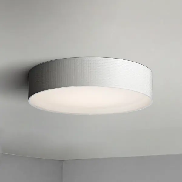Drum shades in a variety of fabrics and materials are a core lighting offering. Flush mounts, pendants, and ADA sconces are available in options of linen, organza, grasscloth, and sound absorbing grey felt shades. An internal acrylic diffuser, illuminated by an evenly dispersed powerful LED light source, directs light downward and produces an ambient glow inside the outer shade. This lens features a crisp and tidy twist-lock mechanism that eliminates any visible hardware. whether it is put in a residential or commercial context, this collection meets the necessary application needs while adding style to the space. Collection: Prime Width: 25.00" Height: 5.50" Length: 25.00" Weight: 6.66 lb Wire: 8" Bulbs Included Number of Bulbs: 1 Maximum Wattage: 32.00 W Bulb Type: LED Bulb Base: Integrated Light Source: LED Light Output: 2000.00 lm Color Temperature: 3000 K CRI: 90 Rated Average Life: 35000 Voltage: 120.00 V Material: Steel, Acrylic, Fabric Safety Listing: cETLus Safety Rating: Dry LED Spec Sheet Instructions - alternate view