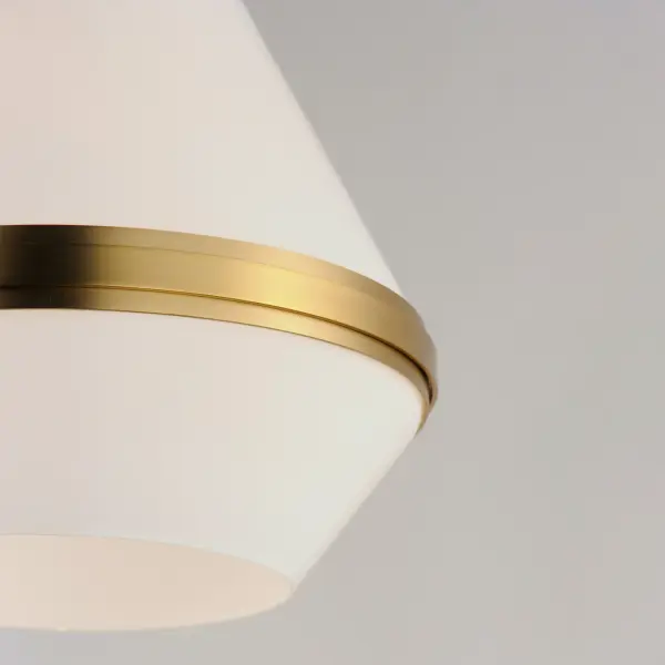 A glossy White glass shade, conical in form, is combined with sharp-lined bands of metal finished in your choice of Polished Nickel or Satin Brass to create a pyramid of softly diffused light. Squared off trapezoidal chain loops connect to squared chain links allowing for over ten feet of adjustment. Though modern with its angular form, this pendant applies traditional metalwork details to create a timeless piece perfect for over a kitchen island or bedside. Collection: Giza Finish: Satin Brass Glass: White Width: 15.50" Height: 23.00" Length: 15.50" Weight: 7.50 lb Chain: 36" Wire: 120" Canopy: 5.5"x5.5"x2.25" Number of Bulbs: 1 Maximum Wattage: 60.00 W Bulb Type: A20 Bulb Base: E26 Medium Light Source: Incandescent Dimmable Voltage: 120.00 V Material: Steel, Glass Safety Rating: Dry Spec Sheet Instructions - alternate view