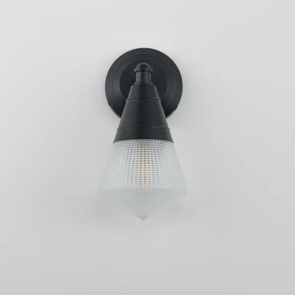 A prismatic diffusion of light is housed within pressed cone glass shades. Choose from pendants with tapered metal halves that conceal the light source or glass shades that are supported by a metal ring. Coordinating bath vanity lights complete the collection. - alternate view