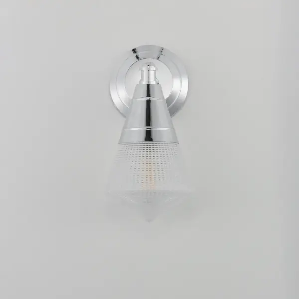 A prismatic diffusion of light is housed within pressed cone glass shades. Choose from pendants with tapered metal halves that conceal the light source or glass shades that are supported by a metal ring. Coordinating bath vanity lights complete the collection. Collection: Hargreaves Finish: Polished Chrome Glass: Prairie Rib Frost Width: 6.00" Height: 12.00" Weight: 3.00 lb Extension from Wall: 7.00" Wire: 8" Canopy: 5"x5" Number of Bulbs: 1 Maximum Wattage: 60.00 W Bulb Type: A19 Bulb Base: E26 Medium Light Source: Incandescent Dimmable Voltage: 120.00 V Material: Steel, Glass Safety Listing: cULus Safety Rating: Damp Manufacturer Warranty: 3 Spec Sheet Instructions - alternate view