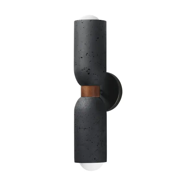 A tribute of natural materials, this collection features carved stone shades in your choice of Travertine or volcanic Lava Rock, paired with coordinating lathed wood bases. The Travertine composition showcases White Oak wood and Ecru white metal accents, while the blackened Lava Rock is beautifully complemented by Walnut wood and a Matte Black finish. Available in versatile pendant and wall sconce configurations, each piece highlights the organic beauty and timeless sophistication of its materials.