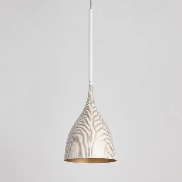 Graceful and sculptural, Fleur's gently flared silhouette brings a sense of quiet sophistication to any space. Hand-spun metal shades are adorned with a striated finish, scraped by hand to reveal glowing Gold undertones beneath layers of Matte Black or White. A matching Gold interior warms the light within, while a coordinating fabric cord suspends them for convenient height adjustments. Offered in multiple pendant sizes and a flush mount, Fleur offers tailored elegance to interior spaces such as entries and over a kitchen island. Collection: Fleur Finish: White/Gold Width: 8.25" Height: 12.75" Length: 8.25" Weight: 2.75 lb Wire: 120" Canopy: 5"x5"x0.5" Number of Bulbs: 1 Maximum Wattage: 60.00 W Bulb Type: E26 Bulb Base: E26 Medium Light Source: Incandescent Voltage: 120.00 V Material: Steel Safety Listing: cULus Safety Rating: Dry Spec Sheet - alternate view