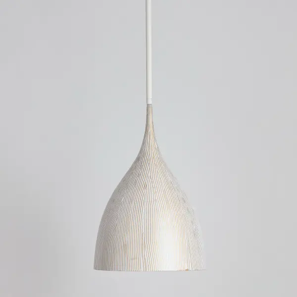 Graceful and sculptural, Fleur's gently flared silhouette brings a sense of quiet sophistication to any space. Hand-spun metal shades are adorned with a striated finish, scraped by hand to reveal glowing Gold undertones beneath layers of Matte Black or White. A matching Gold interior warms the light within, while a coordinating fabric cord suspends them for convenient height adjustments. Offered in multiple pendant sizes and a flush mount, Fleur offers tailored elegance to interior spaces such as entries and over a kitchen island. Collection: Fleur Finish: White/Gold Width: 12.50" Height: 20.00" Length: 12.50" Weight: 4.51 lb Wire: 120" Canopy: 5"x5"x0.5" Number of Bulbs: 1 Maximum Wattage: 100.00 W Bulb Type: E26 Bulb Base: E26 Medium Light Source: Incandescent Voltage: 120.00 V Material: Steel Safety Listing: cULus Safety Rating: Dry Spec Sheet - alternate view