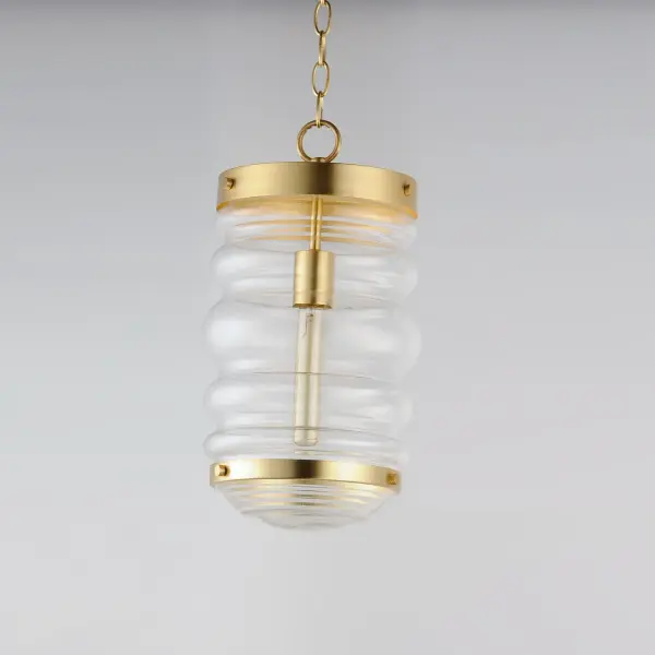 An oversized oscillating, cylinder of Clear Seedy glass adds to a variety of coastal inspired pendants. Three knurled edge set screws support a massive glass with a ribbed bottom. Pair the clear glass shades with tubular filament lamps to complete the look. - alternate view