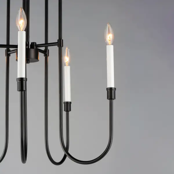 Updating the traditional chandelier form, the Tux collection uses elongated sweeping lines evocative of the mid-20th century and stripped down ornamentation to create a transitional lighting product relevant again. The two-tone Black and White powder coated finish offers a neutral color palette, which coordinates perfectly with a variety of settings. Use decorative tubular bulbs or globes to dress up the design, or keep it classic with candelabra lamps. - alternate view