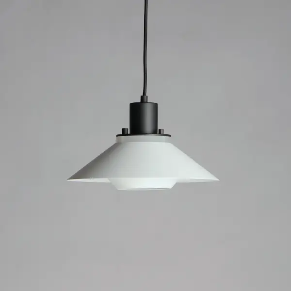 Influenced by early modern Scandinavian design, the Oslo pendants feature a light reveal above the shade as well as an inner shade that reduces glare and creates an interesting lighting effect. Finished in a combination of Matte White shades with Matte Black tops, this design coordinates with any color in a space. Available in 3 sizes, these pendants fit over various size counters as well as smaller dining areas. - alternate view