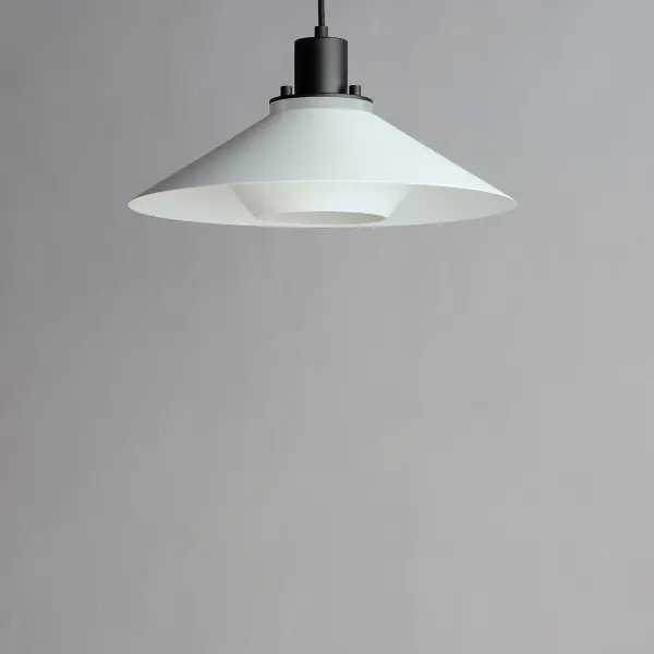 Influenced by early modern Scandinavian design, the Oslo pendants feature a light reveal above the shade as well as an inner shade that reduces glare and creates an interesting lighting effect. Finished in a combination of Matte White shades with Matte Black tops, this design coordinates with any color in a space. Available in 3 sizes, these pendants fit over various size counters as well as smaller dining areas. - alternate view