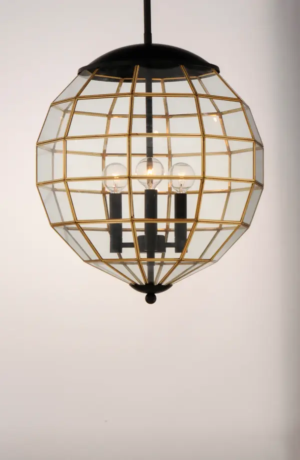 A return of Bound Glass lighting, Heirloom features a classic globe shape with rectilinear clear glass panels finished in two-tone Black and Burnished Brass. The wall mounts are made of brass and aluminum which makes them suitable for outdoors as well as indoors. - alternate view