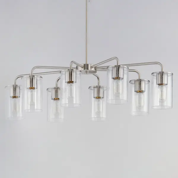 Cylinders in Clear Seeded glass on simple Satin Nickel frames or matte Black frames with Antiqued Brass socket covers. Pivoting arms on chandelier allow it to direct light up or down. Use filament lamps either tubular or Edison in shape for a Coastal or Industrial look, or use a traditional A19 to create a more transitional look. A full range of affordable lighting for the kitchen, dining room, bathroom, or bedroom that easily complements fashionable finishes and lasting styles. - alternate view
