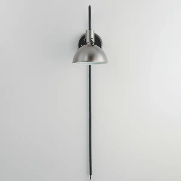 Sockets are suspended above a metal spun dome in your choice of Black or White with Gold accents or Satin Nickel with Black accents. A clean and simple approach to modern or transitional lighting, the opening allows light to shine through the opening atop while providing functional light below. This break in the two parts is supported with straps and decorative rivets in complimentary finishes for a subtlety tasteful two-tone finish. A coordinating pin-up wall sconce offers a bedside application to this design with integrated switch on its back plate and two feet of cord cover that can be removed and hardwired per your preference. - alternate view