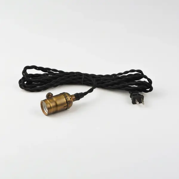 Cords of Black fabric support metal sockets finished in a natural Antique Brass allow you to create unique and fun lighting. All except the single pendant are supplied with hangers that attach to the ceiling to allow you to swag each socket. There are a number of optional bulbs to choose from. - alternate view