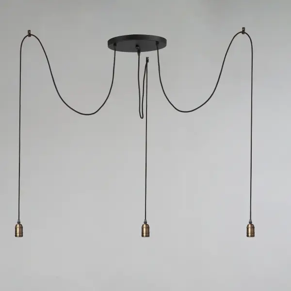 Cords of Black fabric support metal sockets finished in a natural Antique Brass allow you to create unique and fun lighting. All except the single pendant are supplied with hangers that attach to the ceiling to allow you to swag each socket. There are a number of optional bulbs to choose from. - alternate view