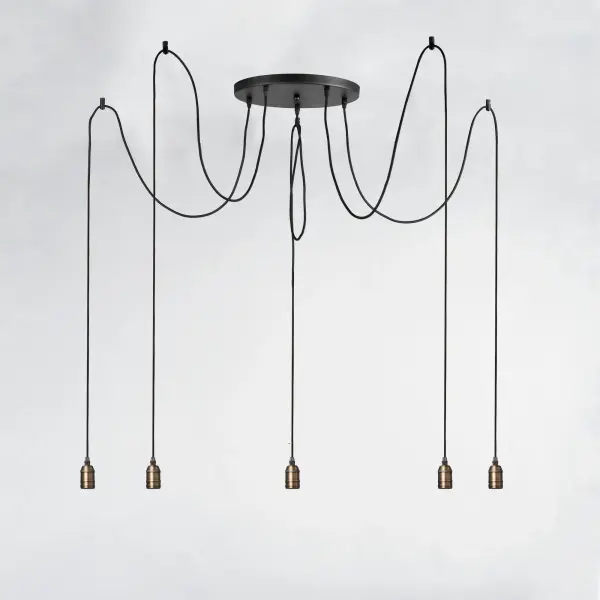 Cords of Black fabric support metal sockets finished in a natural Antique Brass allow you to create unique and fun lighting. All except the single pendant are supplied with hangers that attach to the ceiling to allow you to swag each socket. There are a number of optional bulbs to choose from. - alternate view