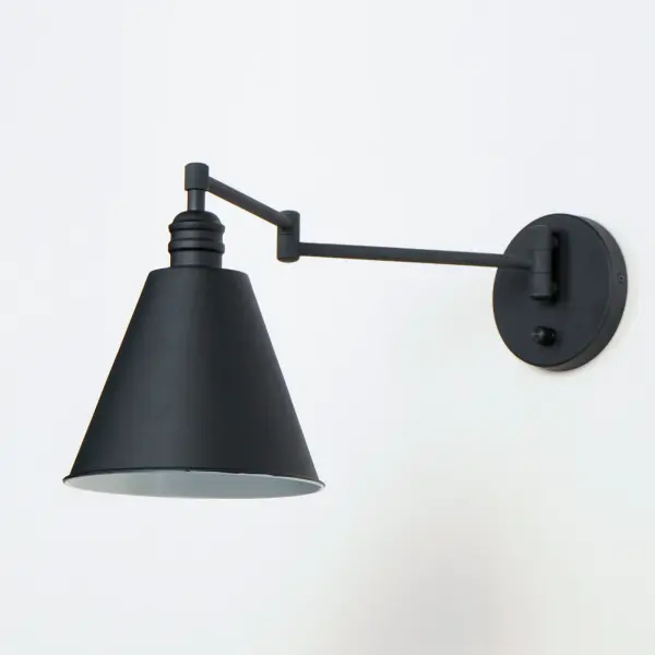 Direct the light exactly where you want it using the articulated arms and metal shades of the Library series. At the backplate, the arm pivots left/right and up/down to direct the light. Additional articulated arms angle the shade or extend/contract the distance of the light source from the wall. Available in Polished Nickel, Black and Heritage Brass finishes, the Library collection evokes industrial era classicism perfect for use as a task light or accent light. Complimentary table and floor lamps complete the collection. - alternate view