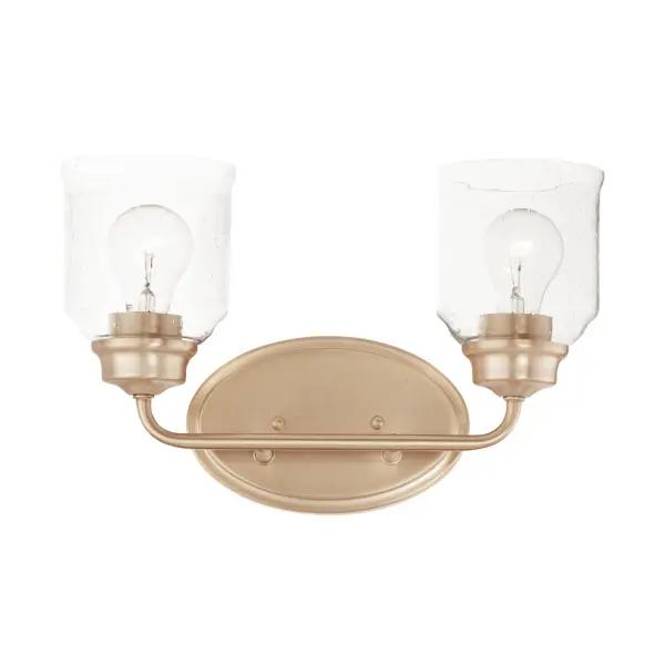 A modest frame of steel tubing gently bends to support a cluster of Clear Seedy bell-shaped glass. Similarly the bobeches and other metal accents echo that traditional bell shape creating an instant classic. An easy choice with transitional appeal, choose from a variety of complimentary finishes including matte Black, Heritage Brass or Satin Nickel. Collection: Acadia Finish: Heritage Glass: Seedy Width: 14.75" Height: 9.00" Weight: 2.95 lb Extension from Wall: 6.50" Wire: 8" Canopy: 5"x8" Number of Bulbs: 2 Maximum Wattage: 60.00 W Bulb Type: E26 Bulb Base: E26 Medium Light Source: Incandescent Dimmable Voltage: 120.00 V Material: Steel + Glass Safety Listing: cETLus Safety Rating: Damp Manufacturer Warranty: 1 Spec Sheet Instructions