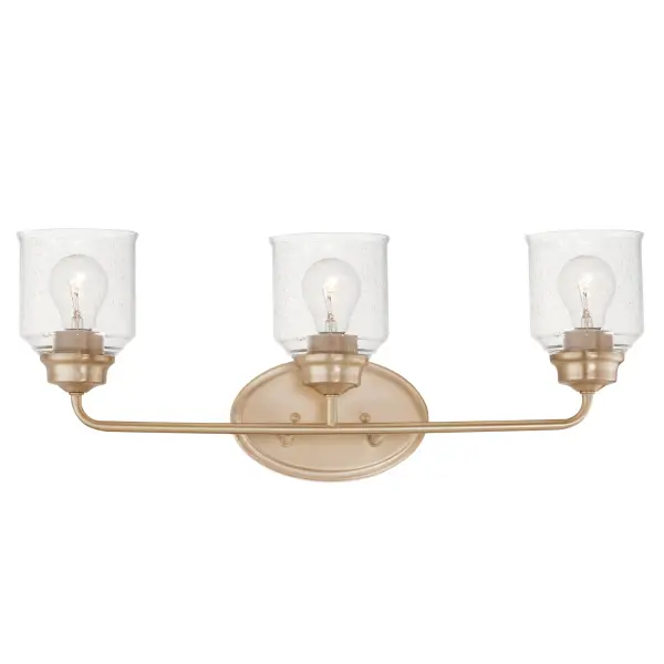 A modest frame of steel tubing gently bends to support a cluster of Clear Seedy bell-shaped glass. Similarly the bobeches and other metal accents echo that traditional bell shape creating an instant classic. An easy choice with transitional appeal, choose from a variety of complimentary finishes including matte Black, Heritage Brass or Satin Nickel. Collection: Acadia Finish: Heritage Glass: Seedy Width: 25.00" Height: 9.00" Weight: 3.28 lb Extension from Wall: 6.50" Wire: 8" Canopy: 5"x8" Number of Bulbs: 3 Maximum Wattage: 60.00 W Bulb Type: E26 Bulb Base: E26 Medium Light Source: Incandescent Dimmable Voltage: 120.00 V Material: Steel + Glass Safety Listing: cETLus Safety Rating: Damp Manufacturer Warranty: 1 Spec Sheet Instructions
