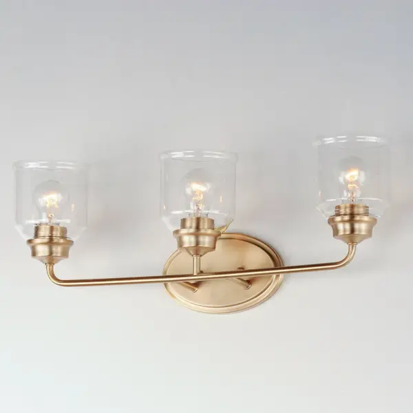 A modest frame of steel tubing gently bends to support a cluster of Clear Seedy bell-shaped glass. Similarly the bobeches and other metal accents echo that traditional bell shape creating an instant classic. An easy choice with transitional appeal, choose from a variety of complimentary finishes including matte Black, Heritage Brass or Satin Nickel. Collection: Acadia Finish: Heritage Glass: Seedy Width: 25.00" Height: 9.00" Weight: 3.28 lb Extension from Wall: 6.50" Wire: 8" Canopy: 5"x8" Number of Bulbs: 3 Maximum Wattage: 60.00 W Bulb Type: E26 Bulb Base: E26 Medium Light Source: Incandescent Dimmable Voltage: 120.00 V Material: Steel + Glass Safety Listing: cETLus Safety Rating: Damp Manufacturer Warranty: 1 Spec Sheet Instructions - alternate view