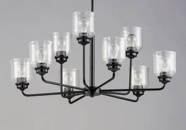 A modest frame of steel tubing gently bends to support a cluster of Clear Seedy bell-shaped glass. Similarly the bobeches and other metal accents echo that traditional bell shape creating an instant classic. An easy choice with transitional appeal, choose from a variety of complimentary finishes including matte Black, Heritage Brass or Satin Nickel. - alternate view
