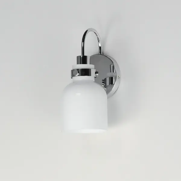 Celebrate nostalgia using these sconces that feature opal White glass shades in a bell shape. Supported on rings of metal in your choice of Polished Chrome or a bolder two-tone Black and Satin Brass, this refreshing take plays into a retro aesthetic of your bathroom decor. Available in various lengths of bath vanity lights or single sconces. - alternate view