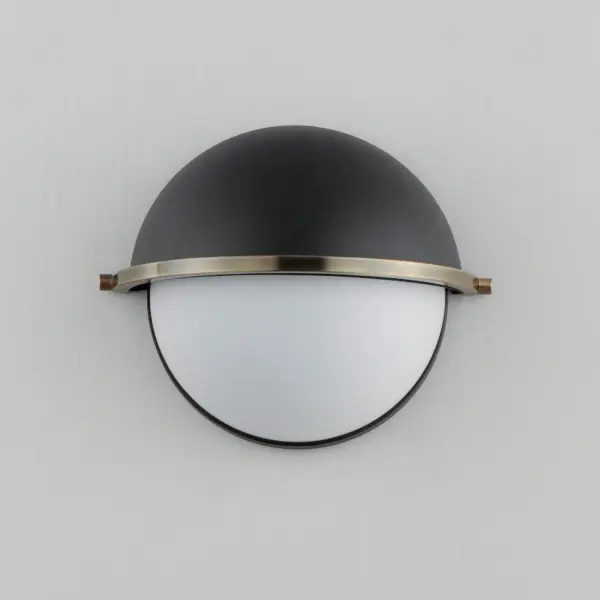 Tasteful globes constructed of metal and glass halves are combined and suspended by an arc-shaped yoke structure. The top dome of robust steel support lower halves of Satin White glass shades that twist lock on for convenience of installation and maintenance. Available in Matte Black with contrasting Weathered Brass or Satin Nickel with Satin Brass two tone finishes, the series includes a full range of products including flush mount, semi-flush mount, single and multi-pendant configurations, and spec-worthy sconces. This attractive design is sure to enhance your projects most needed spaces with an enduring appeal to the design that works in a variety of aesthetics. - alternate view