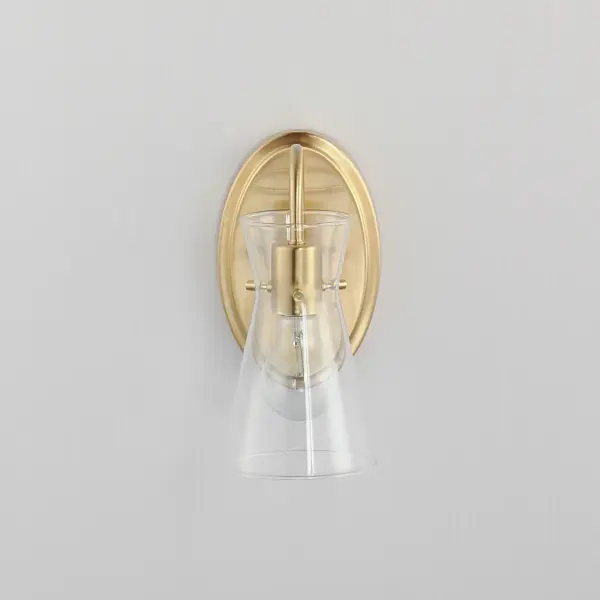 Suspended by three pin connections, the sharp silhouette of Ava's angular glass provides a designer look to enhance your bathroom design. Using Clear glass and a variety of complementary metal finishes the sconces are available in Black, Polished Chrome, or Natural Aged Brass allowing it to pair well with most interior color palettes. Collection: Ava Finish: Natural Aged Brass Glass: Clear Width: 5.00" Height: 9.50" Weight: 1.32 lb Extension from Wall: 6.50" Wire: 6" Canopy: 8"x5" Number of Bulbs: 1 Maximum Wattage: 60.00 W Bulb Type: E26 Bulb Base: E26 Medium Light Source: Incandescent Dimmable Voltage: 120.00 V Material: Steel,Glass Safety Listing: cULus Safety Rating: Damp Manufacturer Warranty: 3 Spec Sheet Instructions - alternate view